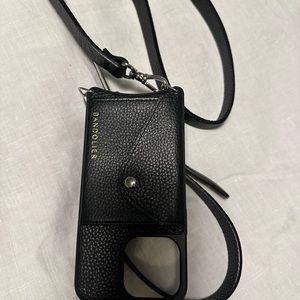 Black Bandolier in excellent condition for use with an iPhone 13 Pro.